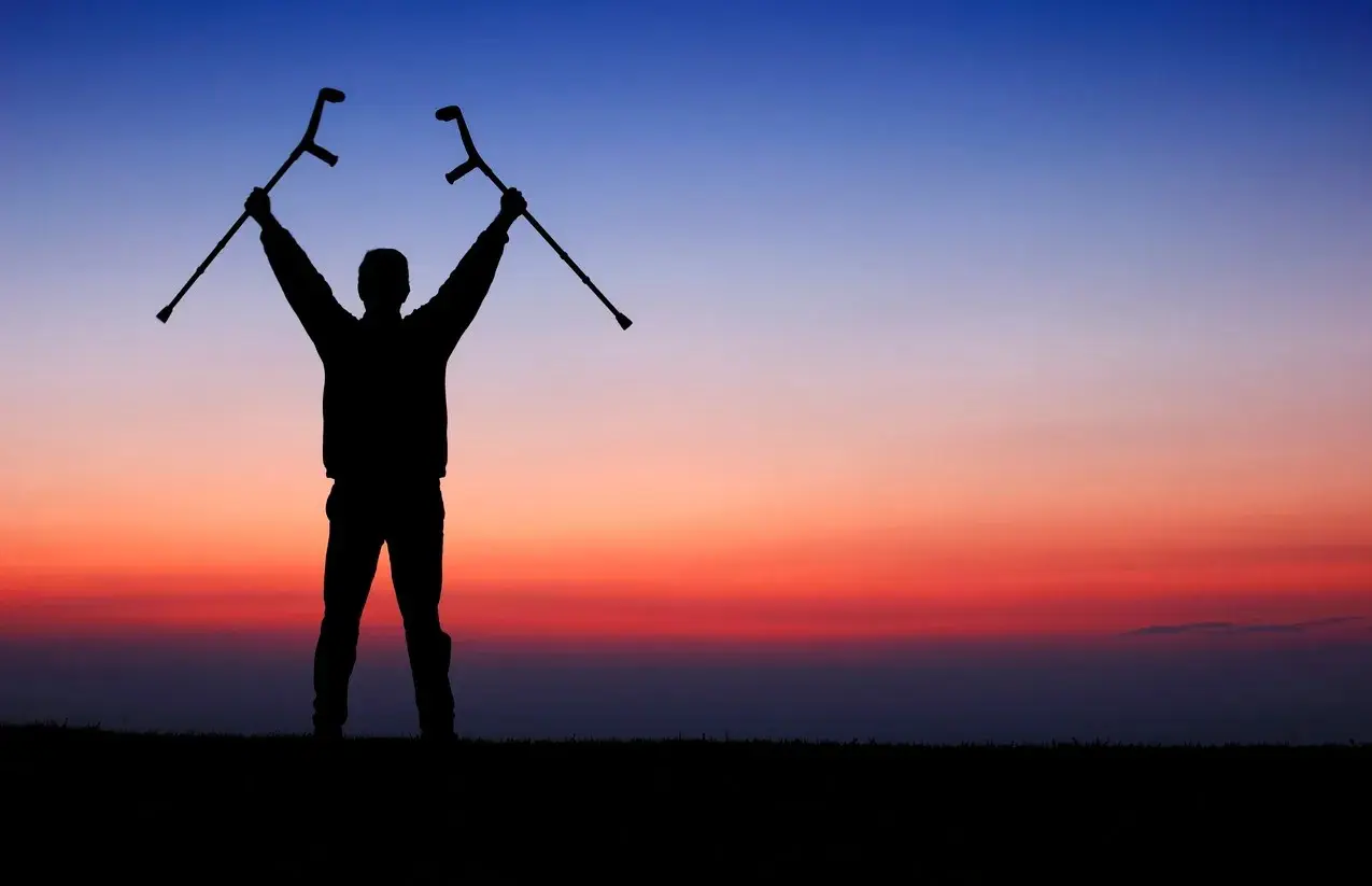 A person holding two poles in the air